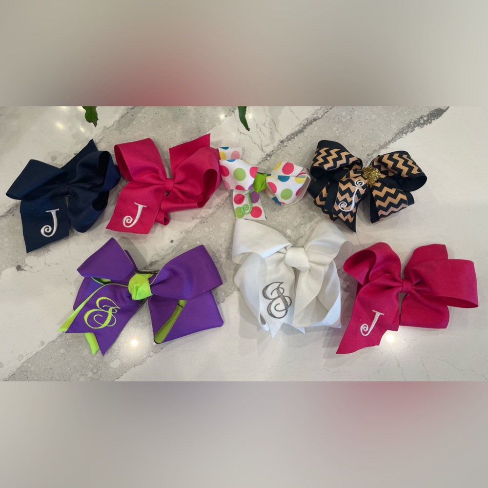 Hair bows monogrammed with the letter “J”